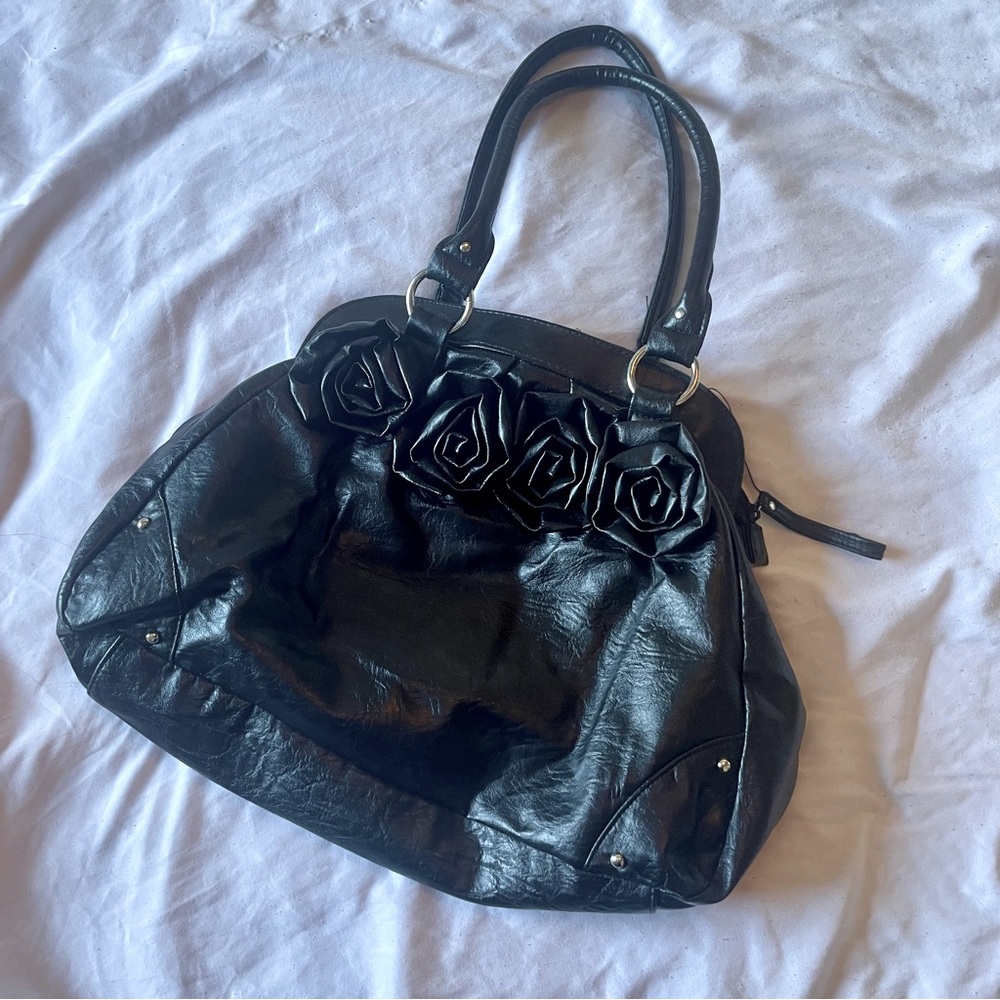 Elegant Black Handbag with Floral Accents